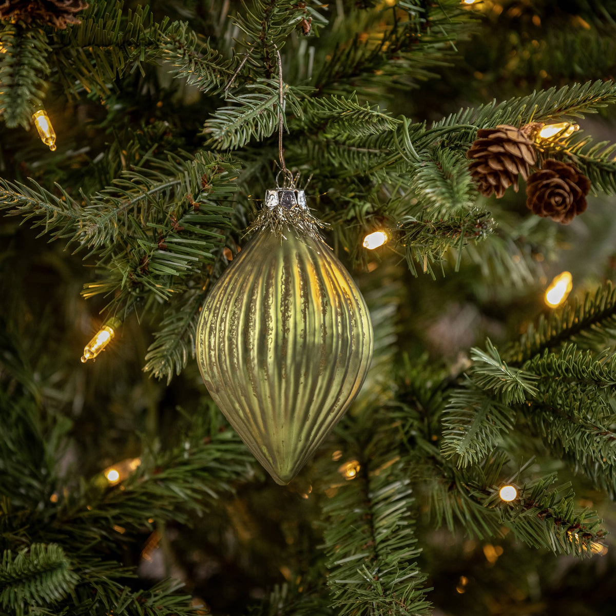 GREEN GLASS ORNAMENT W/ TINSEL TOP
